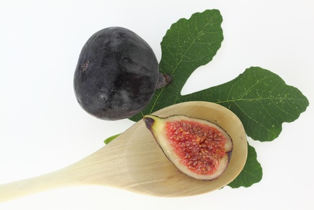Fresh figs in a wooden spoon
