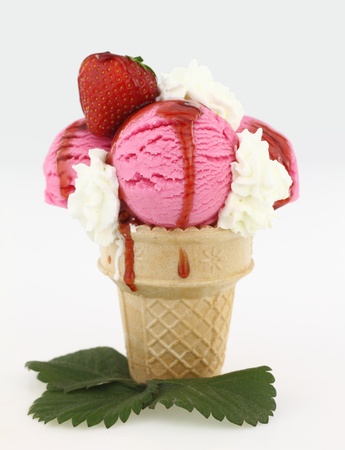 Strawberry ice cream cone on white backgraound の写真素材