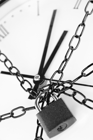 Clock bound with chain and padlock の写真素材