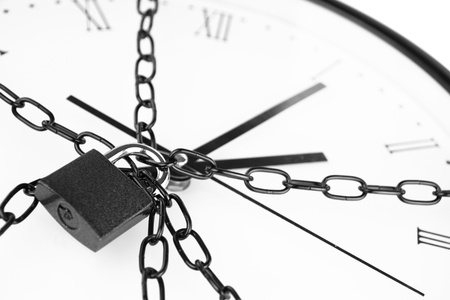 Clock bound with chain and padlock の写真素材