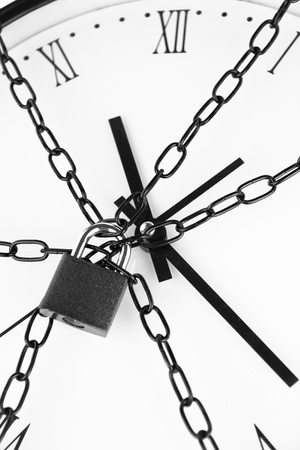 Clock bound with chain and padlock の写真素材