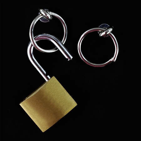 Opened padlock on black background