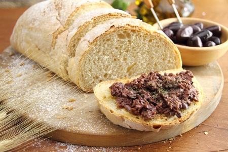 Fresh bread with olive tapenadeの写真素材