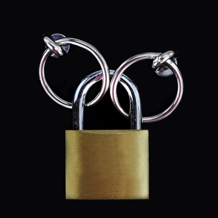 Closed padlock on black backgroundの写真素材