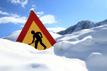  Under construction sign on snowの写真素材