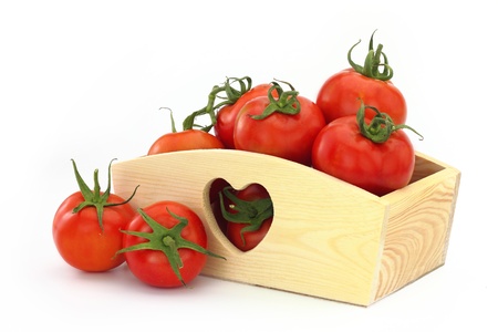 Wooden box full of tomatoesの写真素材