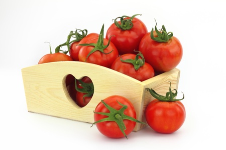 Wooden box full of tomatoesの写真素材