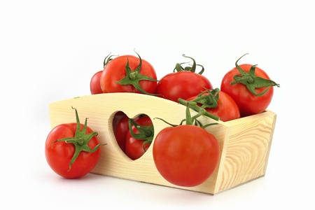 Wooden box full of tomatoesの写真素材