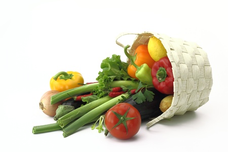 Wicker basket full of fresh vegetablesの写真素材