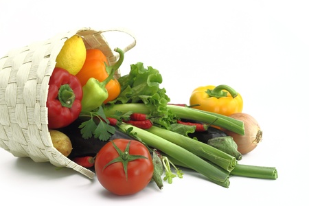 Wicker basket full of fresh vegetablesの写真素材