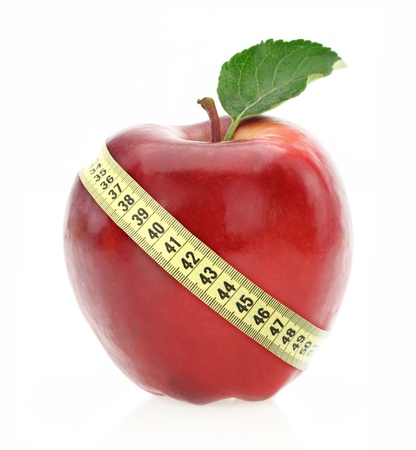 Diet concept. Apple with measuring tapeの写真素材