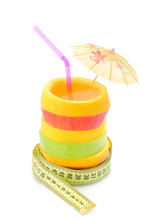 Diet concept. Fruit juice with measure tape の写真素材