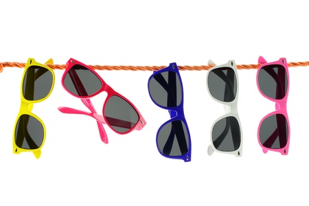 Sunglasses hanging on a rope の写真素材
