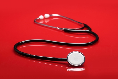 Stethoscope on red backgroundの写真素材