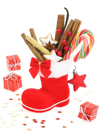 Sweet Christmas. Santa Claus boot stuffed with candies の写真素材