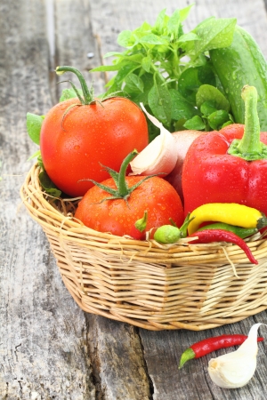 Fresh vegetables in wicker basketの写真素材