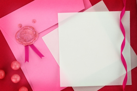 Paper card and pink envelope with sealing wax stampの写真素材
