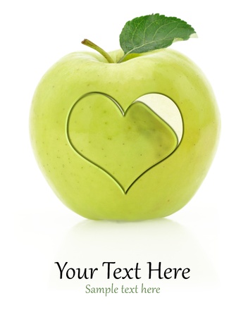 Green apple with heart symbolの写真素材