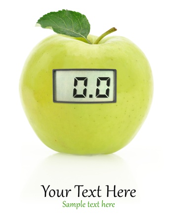 Digital weight scale on a green appleの写真素材