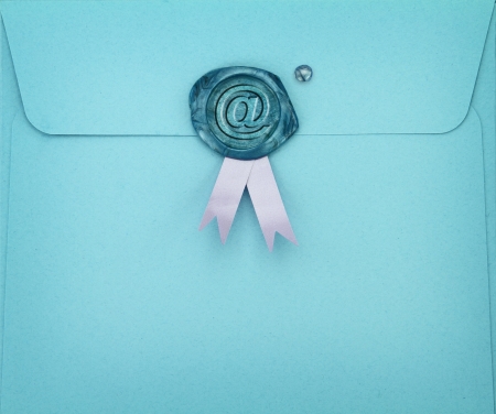 Blue envelope with e-mail symbol on sealing wax stamp の写真素材