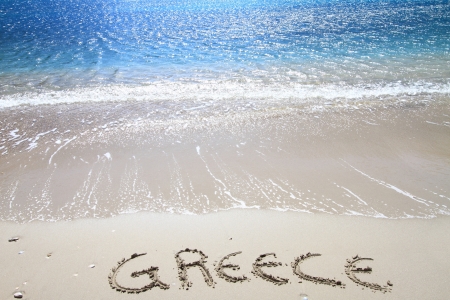 Greece written on sandy beachの写真素材