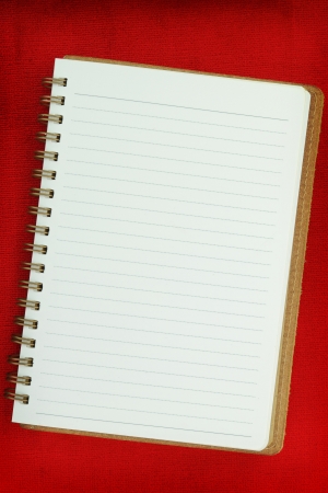 White Blank notebook on red backgroundの写真素材