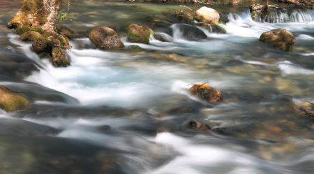 Stream flowing over rocksの写真素材