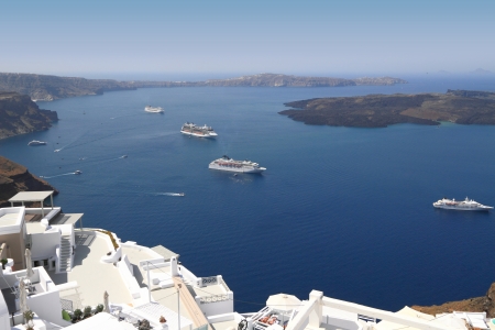 Cruise ships on Mediterranean sea in Santorini islandの写真素材