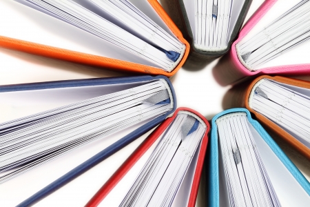 Top view of colorful books in a circle on white backgroundの写真素材