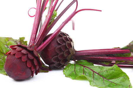 Beautifully carved beetroots isolated on whiteの写真素材