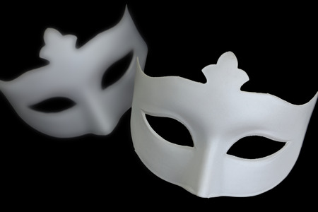 White mask on black backgroundの写真素材