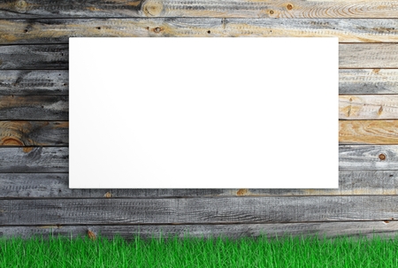 White blank canvas with grass on wooden backgroundの写真素材