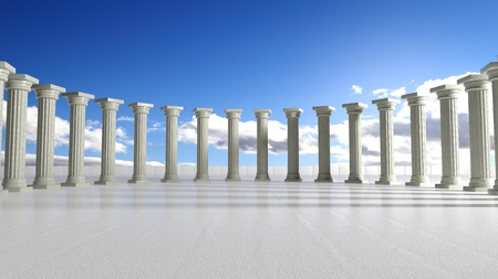 Ancient marble pillars in elliptical arrangement with blue skyの写真素材