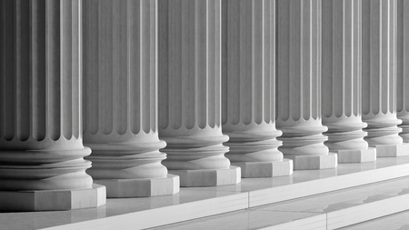White ancient marble pillars in a row 