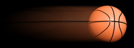 Classic basketball ball in motion isolated on black