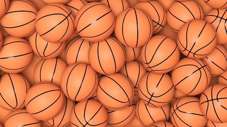 Many basketball balls in pile backgroundの写真素材