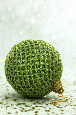 Christmas green ball in a brightly backgroundの写真素材