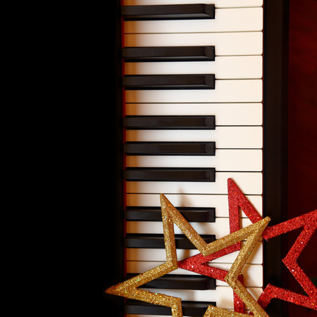Christmas ornaments on piano keysの写真素材
