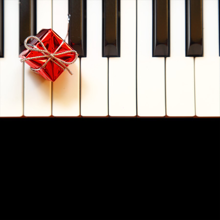 Gift box on piano keysの写真素材