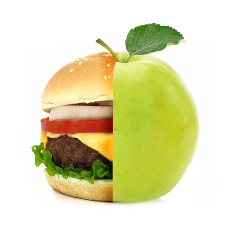 Half burger half apple concept isolated on white backgroundの写真素材