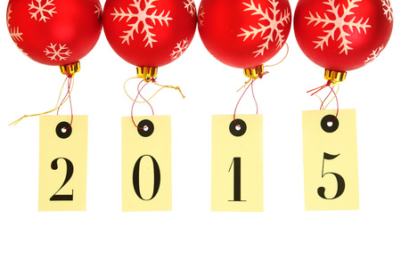 New year 2015 on tags hanging on red Christmas balls