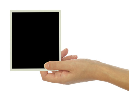 Hand holding blank photo frame isolated on white backgroundの写真素材