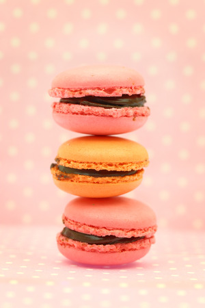 Traditional french colorful macaroons on pink retro backgroundの写真素材