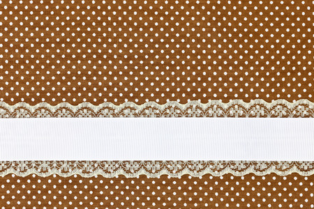 Brown retro polka dot textile background with ribbonの写真素材