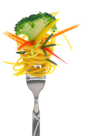 Fresh colorful composition with pasta on fork, isolated on whiteの写真素材