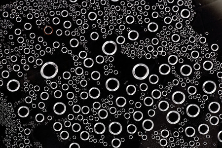 Abstract water bubbles black backgroundの写真素材