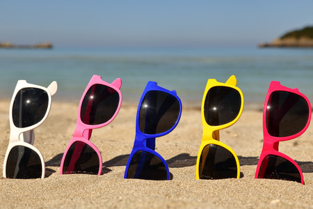 Collection of Sunglasses on the beachの写真素材