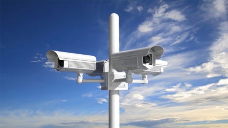 Security surveillance camera with blue sky background