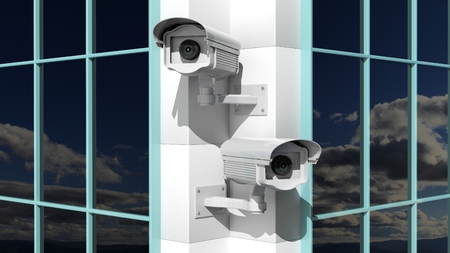 Two security surveillance cameras on skyscraper building
