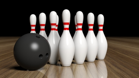 Bowling ball and pins set on wooden floorの写真素材